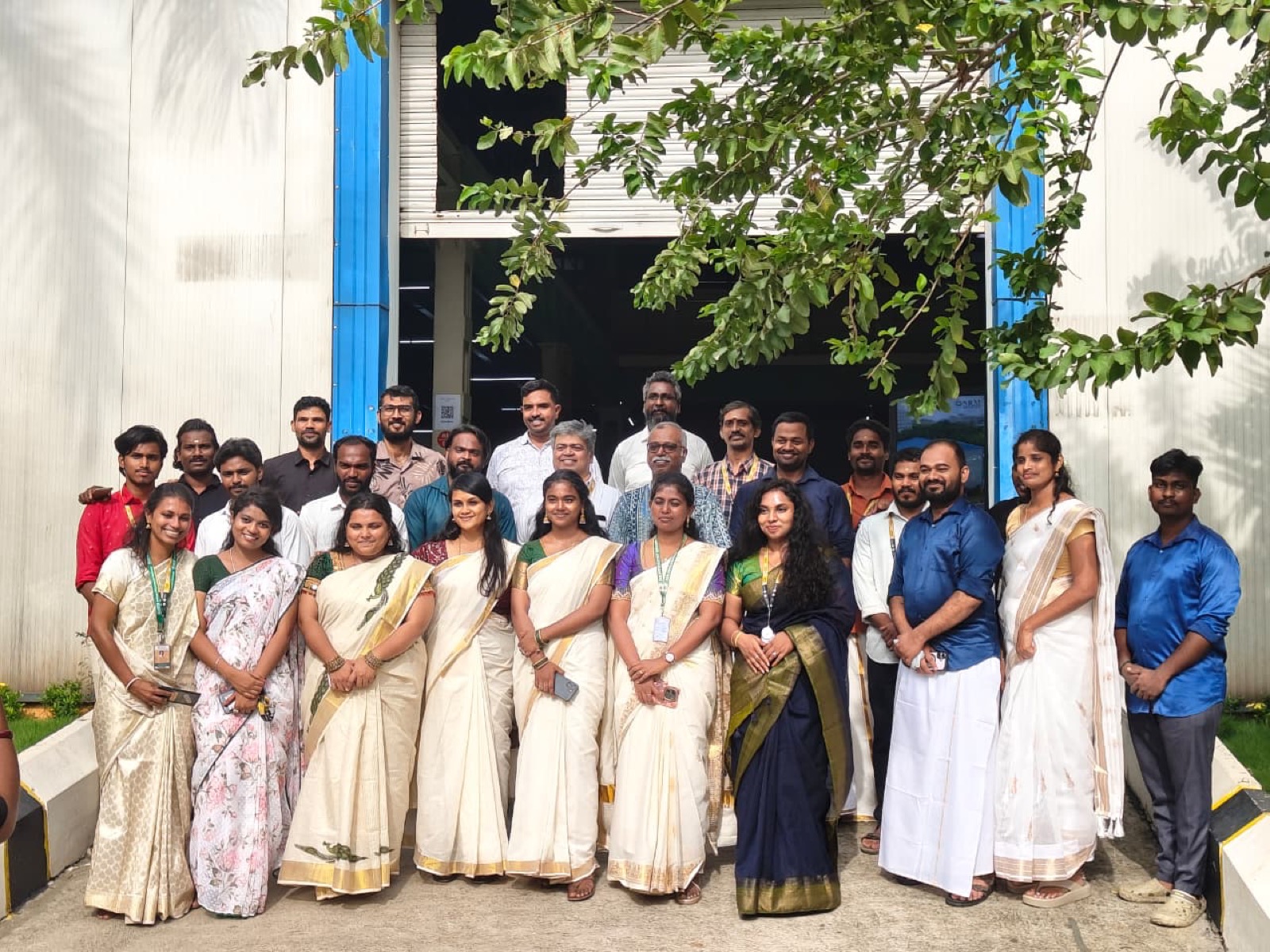 Group photograph of the DEI team during the Onam celebrations