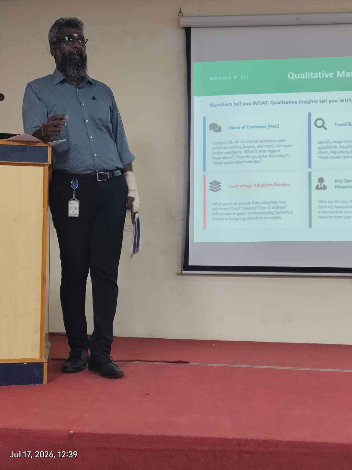 Speaker presenting the Voice of Customer framework at the Creating Value in Research session